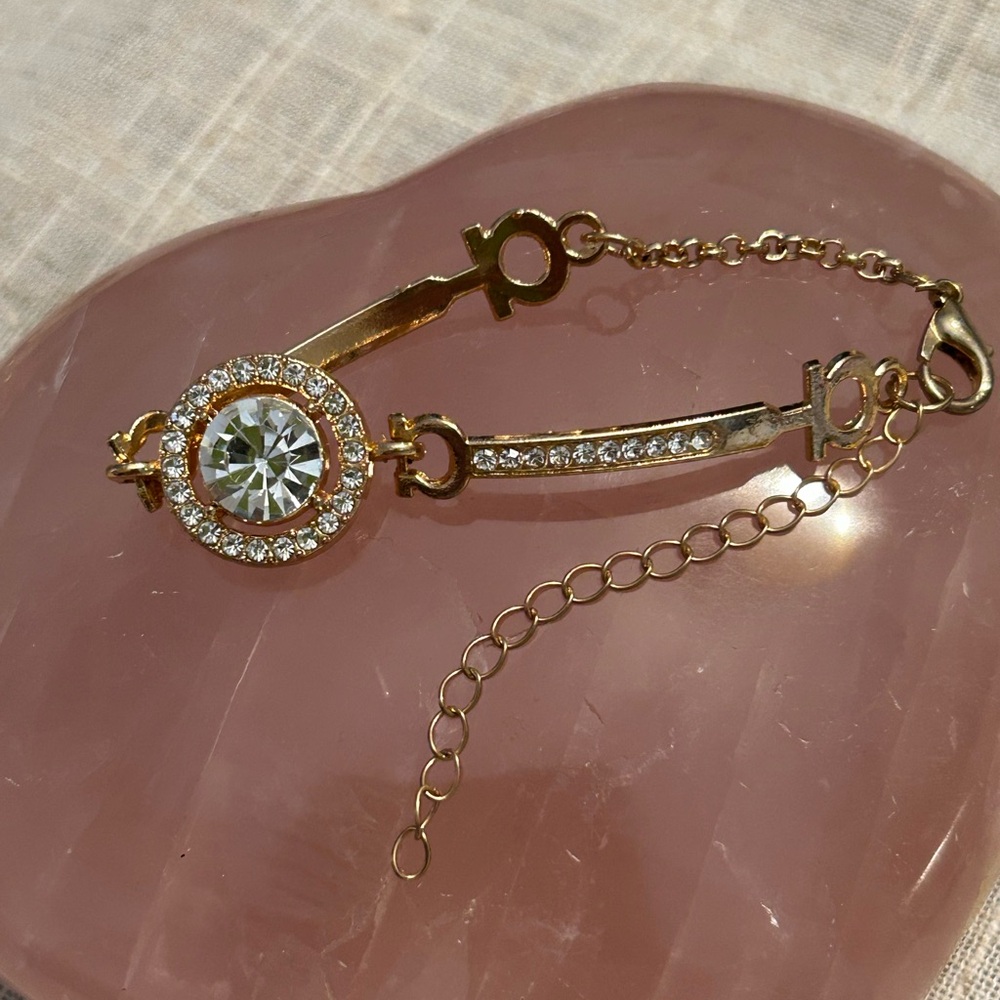 Gold and cubic zirconia focal stone with smaller cz’s each side. - Picture 4 of 9